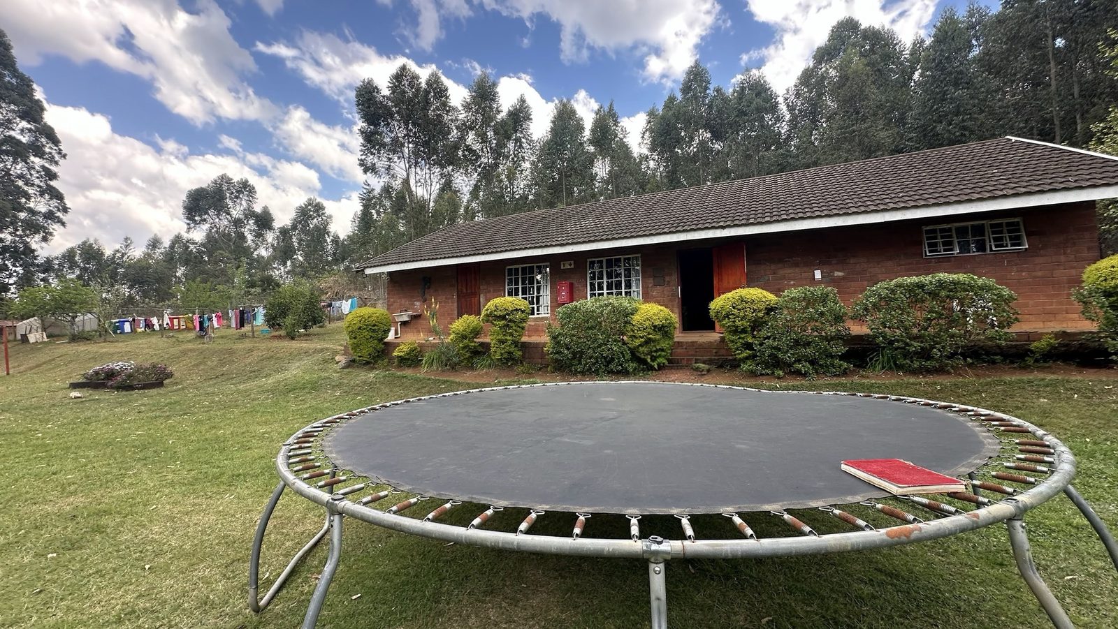 A trampoline set up on the lawn at Khazimula Children's Home
